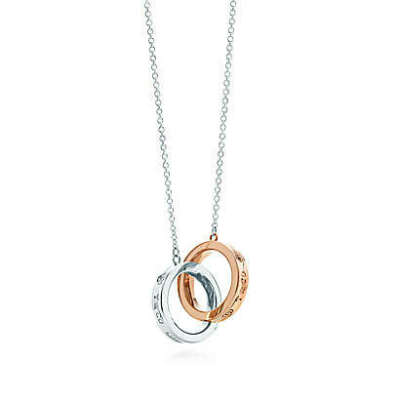 Tiffany & Co. -  Tiffany 1837™ interlocking circles pendant in sterling silver and 18k rose gold.