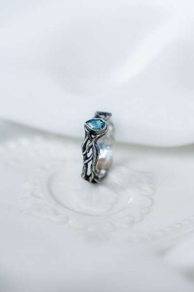 Silver ring with a blue topaz