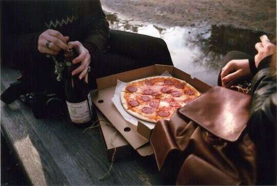 Enjoy the pizza in the company of friends