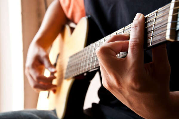 Learn playing the guitar