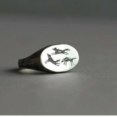 Silver ring with wolves