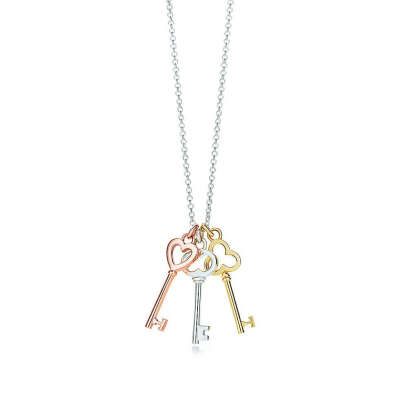 Tiffany & Co. -  Tiffany Keys mini three-key pendant in silver and 18k rose and yellow gold.